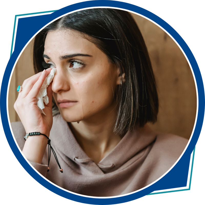 woman wiping tears